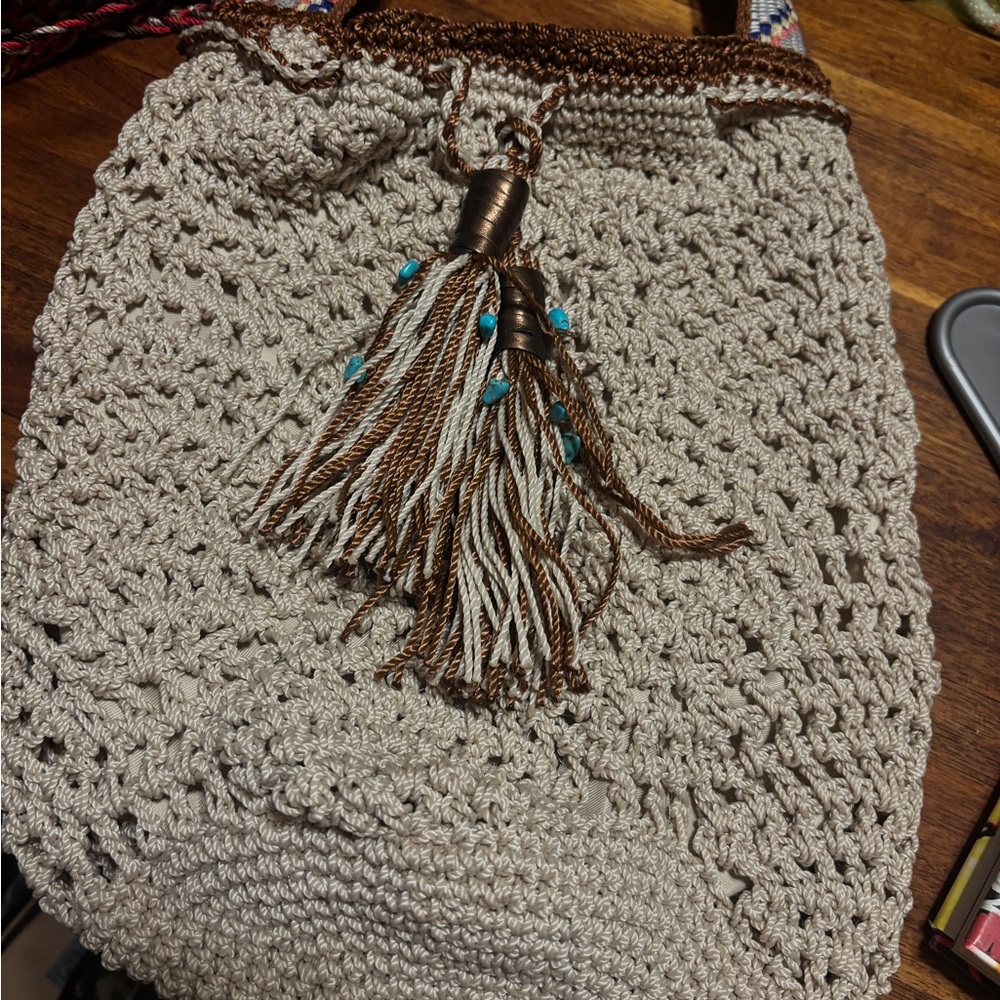 The Sak Cream and Brown Crochet Tassel Shoulder Bag with Turquoise Accents